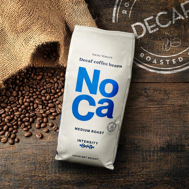 Decaf medium roast coffee beans in a silver bag labeled "NoCa" with intensity rating of 3/5.